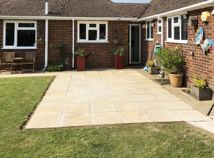 Newly laid paving stone patio at the rear of a private house.