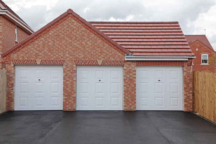 Three new garages in a uk housing development