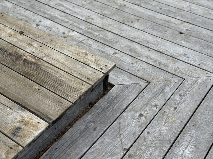Modern house design with wooden patio, low angle view of hardwood decking